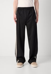 Calvin Klein STRIPE - Trainingsbroek - black