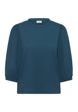 Blouse texturée teal avec des manches courtes bouffantes, un col rond et des poignets élastiques. Design simple avec une couleur unie et aucun motif visible.