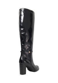 Tall black leather women's boot with block heel and small gold buckle detail near the ankle, photographed against a white background.