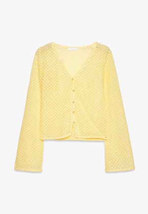 Gelber, verkürzter Cardigan aus strukturiertem, offenköperigem Stoff. Verfügt über einen V-Ausschnitt und fünf Knopfverschlüsse an der Vorderseite. Lange Ärmel.
