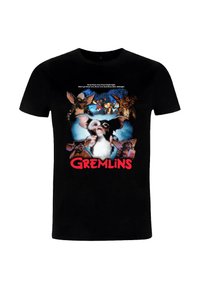 Schwarzes Baumwoll-T-Shirt mit einem grafischen Druck von Gremlins-Charakteren und Text, der ein farbenfrohes Design mit fettgedrucktem roten Schriftzug zeigt.