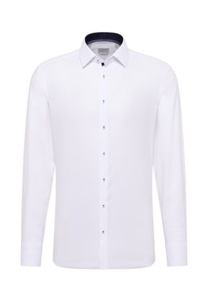 Camicia bianca a maniche lunghe con colletto appuntito, caratterizzata da bottoni argentati e dettaglio interno del colletto con motivo navy. Tessuto dalla consistenza liscia.