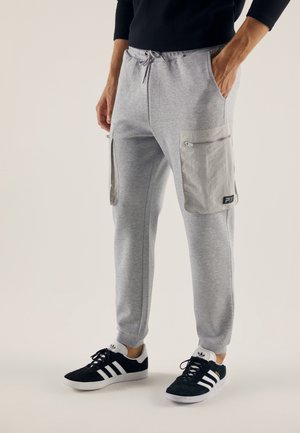 Teplákové kalhoty - mottled light grey