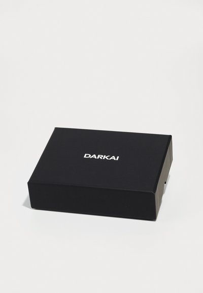 Black rectangular box with white text "DARKAI" centered on the top, placed on a plain white surface.