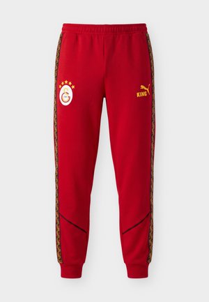 Puma, GALATASARAY SK KING ANTHEM PANTS - Ρούχα για κλαμπ - dark cherry/summer sunset