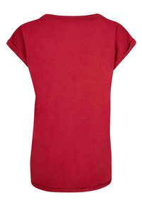 Röd t-shirt med kort ärm, rund halsringning och avslappnad passform. Smidigt bomullstyg, enfärgad och rak nederkant.