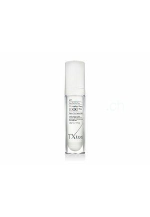 Klare Plastikflasche mit VT Daily Spotless Care TX Toning Essence 1000 Shot, weißem Deckel und schwarzem Text, 30 ml Inhalt.