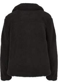 Svart fleecejakke med høy krage, lange ermer og et teksturert, mykt og fluffy stoff sett bakfra.