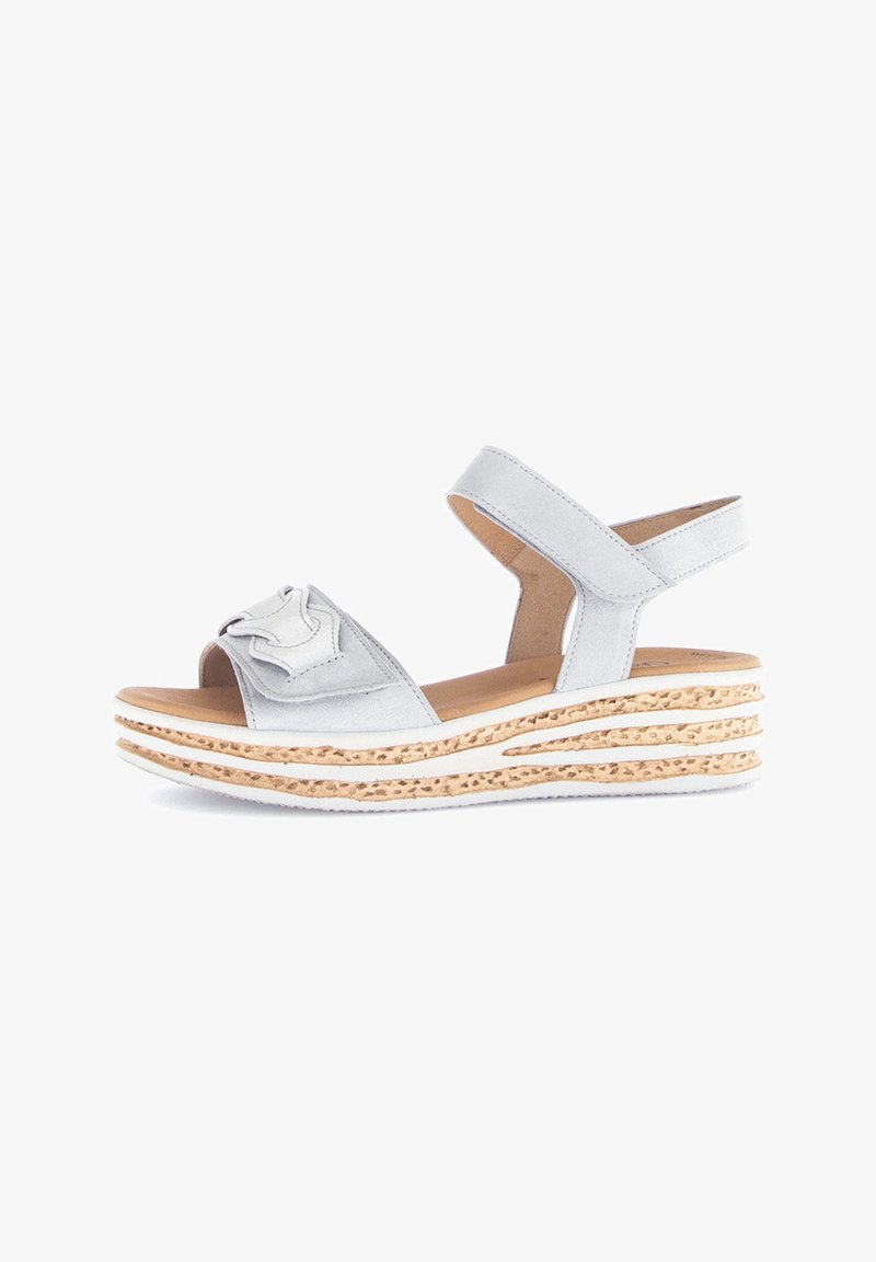 Light gray sandal with an open toe design, featuring a floral accent on the strap and a textured wedge sole with a natural cork finish.
