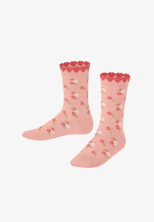 Roze sokken met golvende rode afwerking, voorzien van een bloemenpatroon van rode en witte bloemen op een gladde textuur.