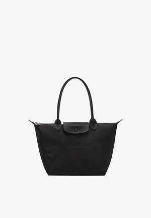 Black tote bag with two shoulder straps, a top zipper, and a front flap pocket with a button closure.