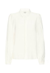 Camisa blanca de manga larga con cuello, que presenta mangas abullonadas y una botonera. Fabricada con una tela ligera y con una textura sutil.