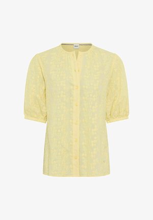 Yellow short-sleeve blouse with floral embroidery, round neckline with a front button placket, and slightly puffed sleeves ending in elastic cuffs.