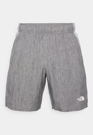 Hallid hallid spordilühikesed, millel on tekstuuritud kangas, elastne vöökoht, küljetaskud ja valge logo vasakul jalal.