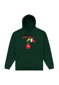 Felpa verde con tasca frontale, caratterizzata da un design del Grinch in stile cartoon, testo rosso che recita "Buon GRINCHMAS!" e un grafico di decorazione rossa.