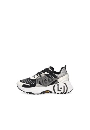Black and white athletic sneaker with patterned mesh upper, translucent side panel, thick white sole with black details, and Vibram branding.