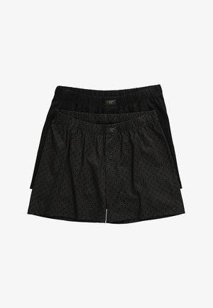 Schwarze Boxershorts, eine einfarbig und eine mit geometrischem Muster. Beide verfügen über einen elastischen Bund und einen Knopfverschluss. Aus weichem Material, lockere Passform.
