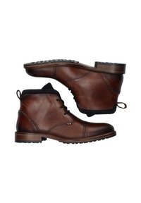Botines de cuero marrón hasta el tobillo con punta redonda, acento texturizado negro en el cuello y suela de goma con patrones antideslizantes.