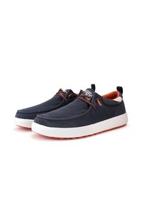 Navy canvas slip-on shoes with orange accents, textured upper, and white rubber sole. Features a flexible design and stitched detailing.