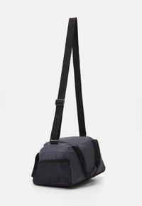 Puma FUNDAMENTALS BAG XS UNISEX - Športna torba - galactic gray