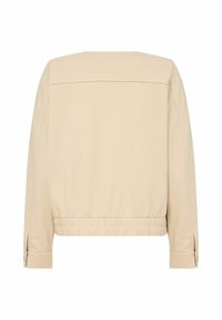 Béžová, lehká bunda s volným střihem, elastickým pasem, dlouhými rukávy a detailem na zadním díle. Hladká textura s manžetami na knoflíky.