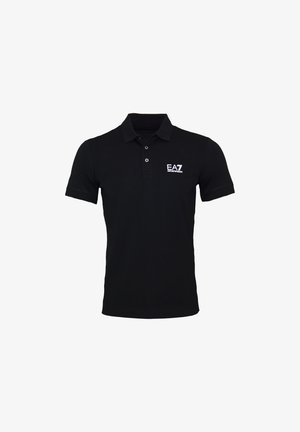 Polo noir en coton, avec un col côtelé, des manches courtes et un petit logo blanc sur la poitrine gauche. Coupe classique.