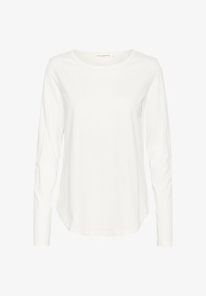 Biała długa koszula z długim rękawem, wykonana z bawełny, z okrągłym dekoltem i zaokrąglonym dołem, zapewniająca luźny fason.