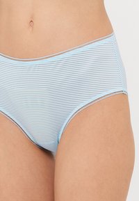 Blue striped hipster briefs made of soft fabric, featuring a lightweight design. Finishing details include a simple trim along the waist.