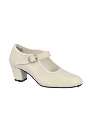 Zapato Mary Jane de cuero color crema con un tacón de bloque de altura media y una hebilla plateada en la parte superior del pie.