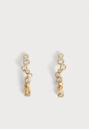 Paire de boucles d'oreilles en or avec sept pierres précieuses rondes et claires disposées verticalement et une petite pierre pendante en bas.