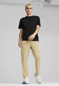 Puma AMG STATEMENT - Camiseta estampada - black