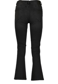 Svarta utsvängda jeans i denim med medelhög midja, med två bakfickor och subtila sömdetaljer. Slät textur med en figurnära passform.