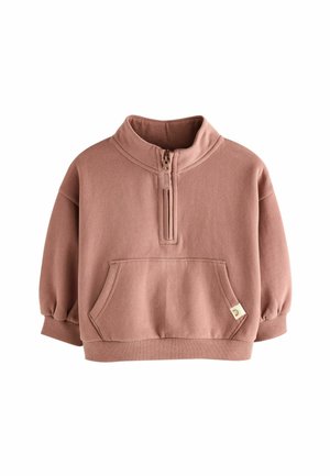 Sweatshirt rose avec un col montant, fermeture éclair demi-longueur, poche avant et poignets côtelés. Fabriqué à partir d'un tissu doux et texturé.