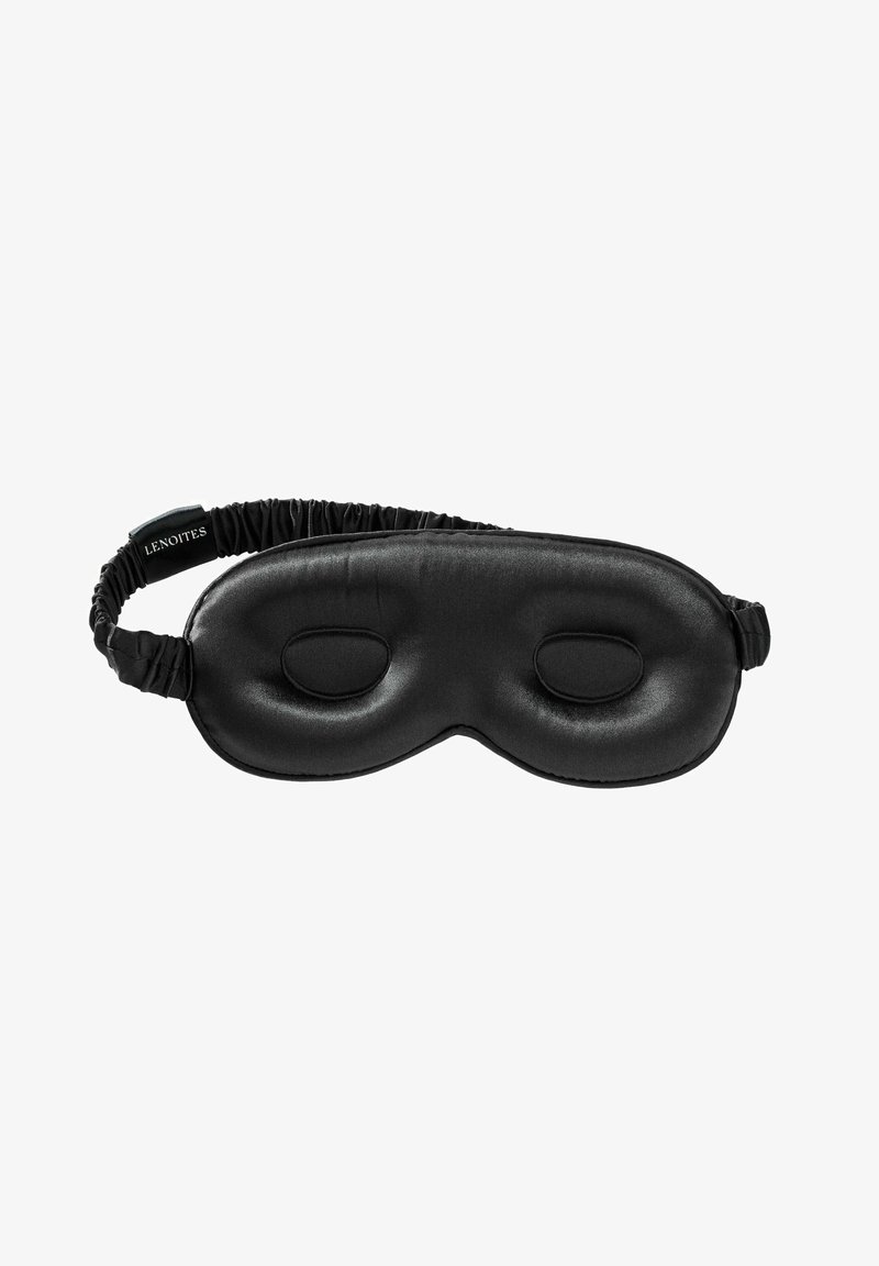 Masque de sommeil noir en satin lisse, présentant une forme incurvée, deux découpes oculaires ovales et une bande élastique pour un ajustement sécurisé.
