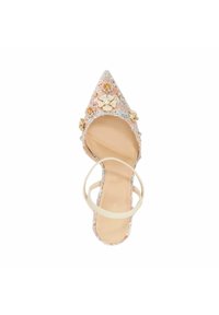 Pink fabric pump with a pointed toe, floral embellishments, and a nude ankle strap. Features a textured surface and decorative details.