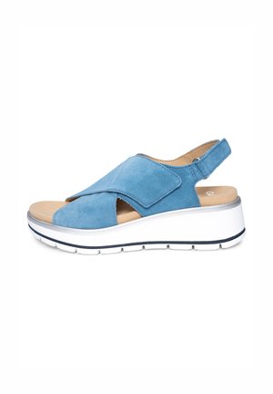 Blue suede open-toe sandal with adjustable strap, cushioned footbed, and white platform sole with black detailing.