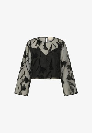 Crop top nero trasparente a maniche lunghe con decorazioni floreali in velluto e scollo rotondo, con corpo interno nero aderente.