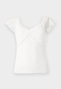 Haut en dentelle blanche avec un décolleté en V, des manches courtes évasées et une silhouette cintrée ornée d'un motif floral texturé sur l'ensemble.