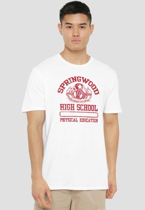 Young man wearing a white T-shirt with red "Springwood High School Physical Education" text and a graphic kettlebell emblem.