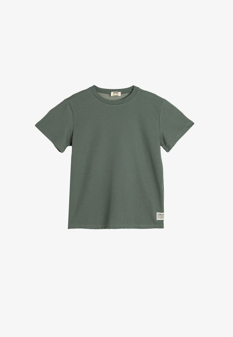 Green short-sleeve t-shirt made of ribbed cotton, featuring a rounded neckline and a small logo tag at the hem.