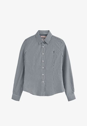 Camicia a maniche lunghe a scacchi bianco e nero con colletto a punta, chiusura con bottone e taschino sul petto. Tessuto in cotone, vestibilità slim.