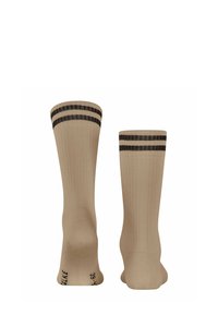 Calze a costine beige con strisce nere in cima. Presentano una punta e un tallone rinforzati. Taglia indicata sul fondo.