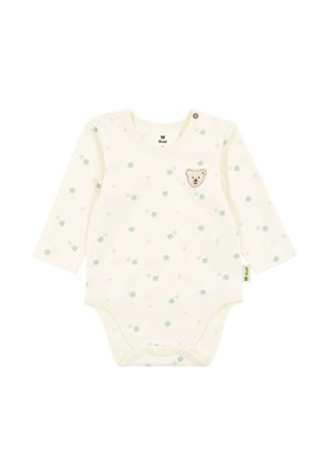 Cremefarbener Baby-Bodysuit mit langen Ärmeln, hellgrünen Kleeblattmotiven und einem kleinen Teddybärgesicht-Patch auf der Brust, Druckknöpfen am unteren Saum und an der Schulter.