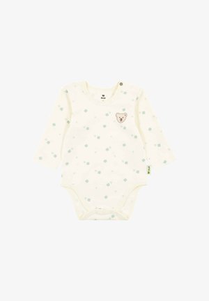 Cremefarbener Baby-Bodysuit mit langen Ärmeln, hellgrünen Kleeblattmotiven und einem kleinen Teddybärgesicht-Patch auf der Brust, Druckknöpfen am unteren Saum und an der Schulter.