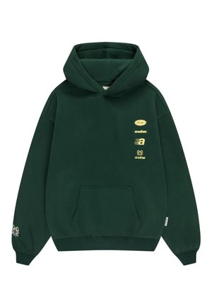 Dark green hoodie with front pocket, hood, small yellow text and graphic logos on the upper left chest and a floral design on the right sleeve cuff.
