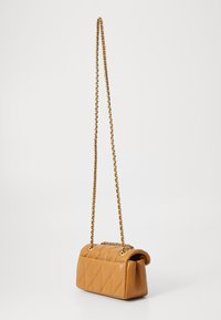Quilted tan leather crossbody bag with a gold chain strap. Soft texture, rectangular shape, and a folded, structured top detail.
