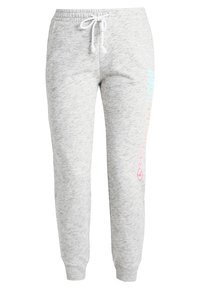 Grå sweatpants i mjukt material med en smalare design. Har elastisk midja, dragsko och en logotyp i färgglada bokstäver på sidan.