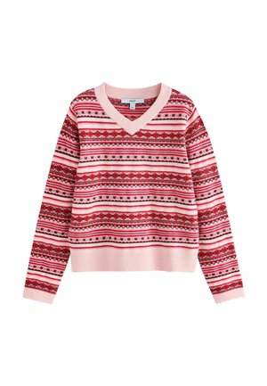 Young woman with shoulder-length brown hair wearing a pink and red patterned sweater, looking slightly to the side against a plain background.