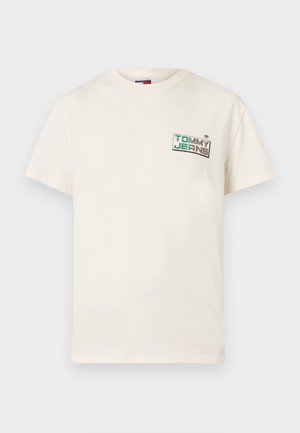 Kreemivärvi puuvillane lühikeste varrukatega T-särk ümmarguse kaelusega, millel on ees roheline ja must tekstiga logo.