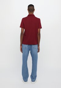Michael Kors INTERLOCK ZIP  - Polo shirt - dark red